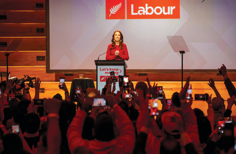 New Zealand Prime Minister Jacinda Ardern claims victory over challenger Judith Collins at a Labour Party election night event in Auckland on October 17 (credit: REUTERS)