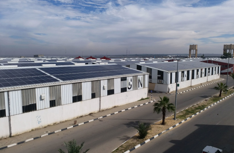 Solar panels seen on the rooftop of Gaza industrial zone facilities in the eastern Gaza Strip on Nov. 24, 2020.  (photo credit: HAZEM ALBAZ)