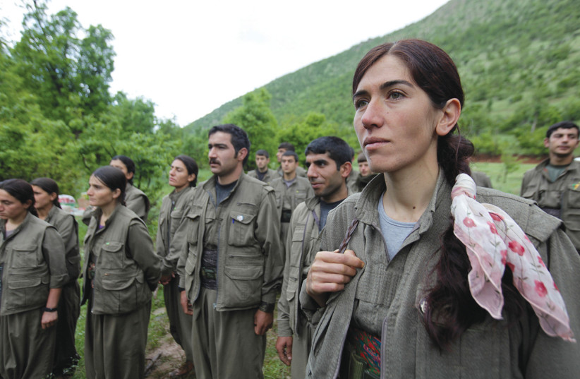 PKK fighters stand in formation in northern Iraq in 2013 (credit: AZAD LASHKARI / REUTERS)