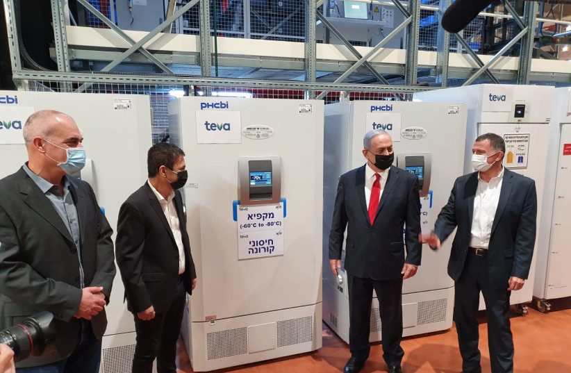 Prime Minister Benjamin Netanyahu and Health Minister Yuli Edelstein visit the Teva SLE Logistic Center, which is due to store and handle the vaccines against coronavirus under special conditions, November 26, 2020 (photo credit: Courtesy)