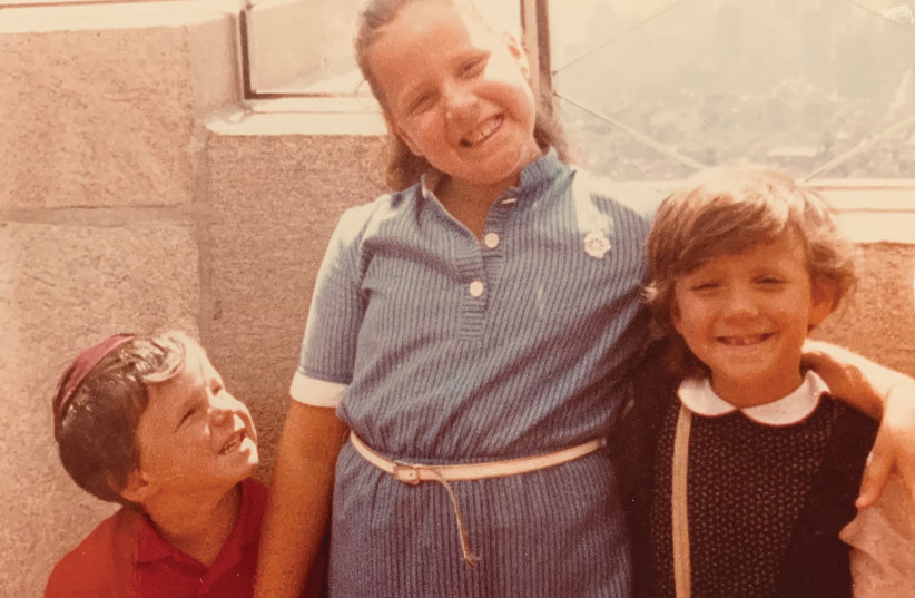 The writer at the top of NYC's Empire State Building with two of her younger siblings (photo credit: HADASSAH COHEN)