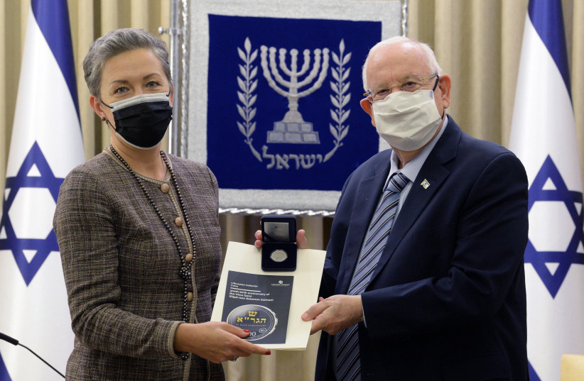 President Rivlin was presented with a special medallion honoring the 300th anniversary of the Vilna Gaon (photo credit: MARK NEYMAN / GPO)