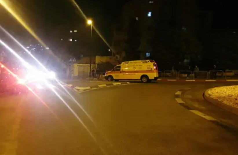 Magen David Adom ambulance is seen at the scene of a domestic violence incident in Jerusalem, in which a man stabbed three family members. November, 27,2020. (credit: MAGEN DAVID ADOM)