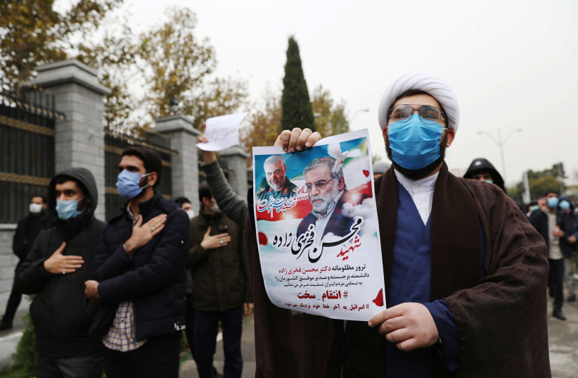 Protesters gather during a demonstration against the killing of Mohsen Fakhrizadeh, Iran's top nuclear scientist, in Tehran, Iran, November 28, 2020. (photo credit: MAJID ASGARIPOUR/WANA (WEST ASIA NEWS AGENCY) VIA REUTERS)