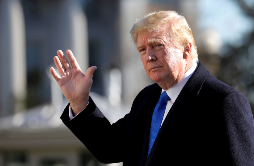 US President Donald Trump waves as he walks on the South Lawn of the White House upon his return to Washington from Camp David, US, November 29, 2020. (photo credit: REUTERS/YURI GRIPAS)