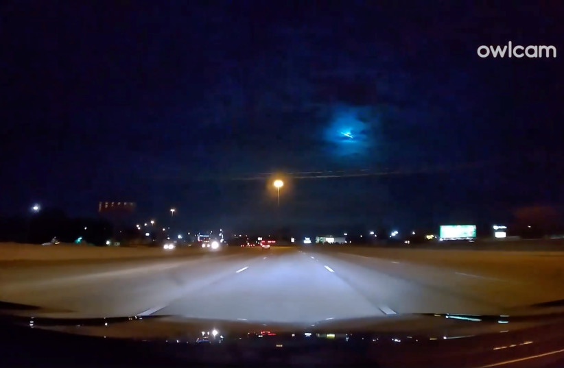 A bright fireball, believed to be a meteor streaks across the sky over city of Austin, 2019 (photo credit: ORLANDO RODRIGUEZ /VIA REUTERS)