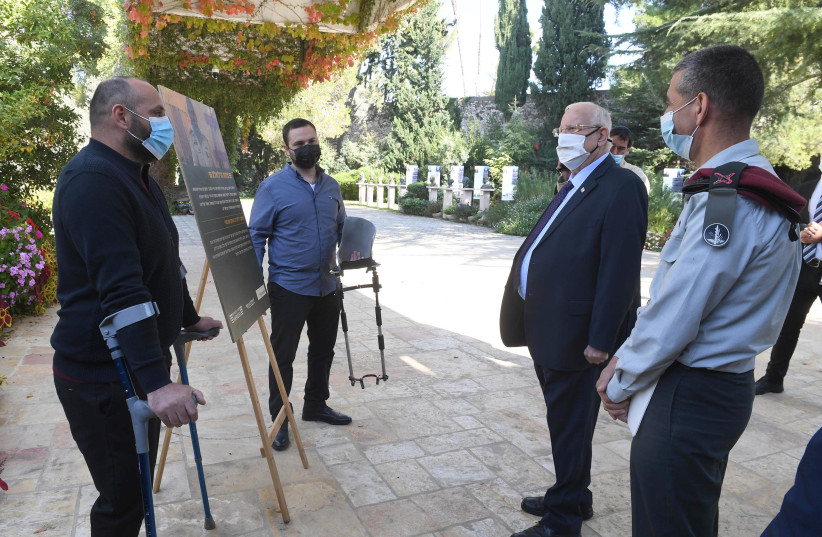 President Reuven Rivlin is seen meeting with representatives from Restart. (photo credit: MARK NEYMAN/GPO)