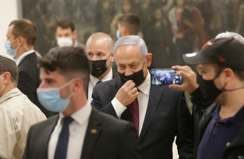 Prime Minister Benjamin Netanyahu is seen during the preliminary vote to disperse the Knesset on December 2, 2020. (photo credit: ALEX KOLOMOISKY/YEDIOT AHARONOT/POOL)