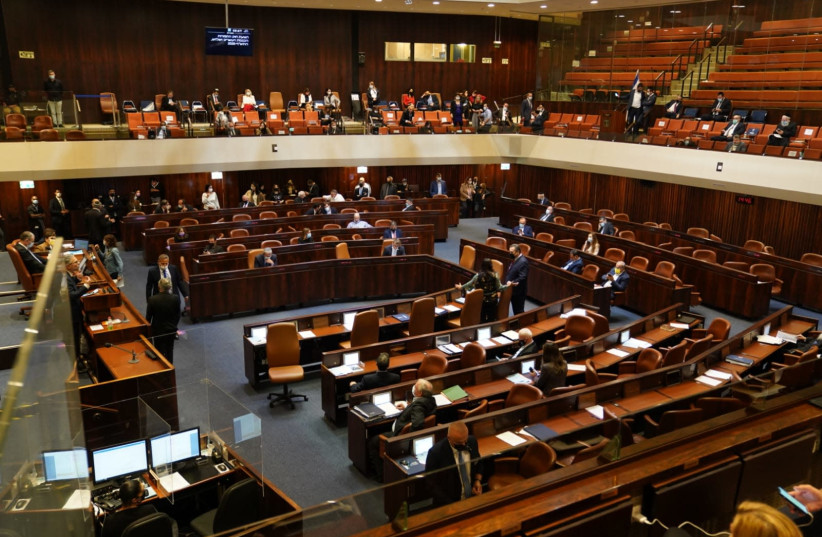 Lawmakers are seen in the Knesset plenum during the preliminary vote to dissolve the Knesset on December 2, 2020.. (photo credit: KNESSET SPOKESPERSON/DANI SHEM TOV)