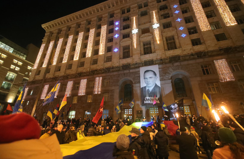 Marchers rally outside the Kyiv City State Administration during a torchlight procession honoring Stepan Bandera in the Ukraine capital, Jan. 1, 2020.  (credit: PAVLO_BAGMUT/ UKRINFORM / BARCROFT MEDIA VIA GETTY IMAGES)