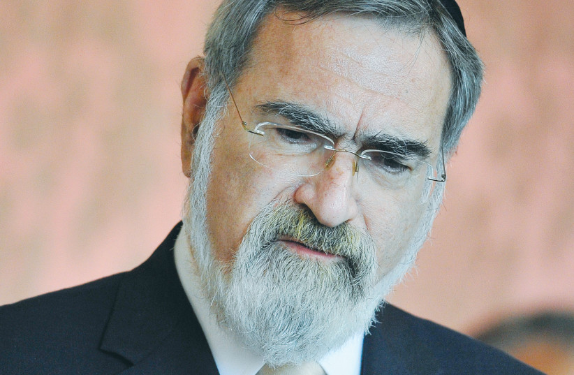 RABBI LORD Jonathan Sacks speaks at St. Mary’s University College Chapel in London in September. (photo credit: TOBY MELVILLE/REUTERS)