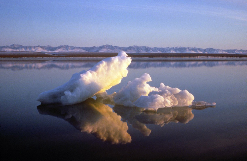 Sea ice floats within the 1002 Area of the Arctic National Wildlife Refuge in this undated handout photo provided by the US Fish and Wildlife Service Alaska Image Library. The Brooks Range mountains, which are not part of the 1002 area, are seen in the distance. US Senate Democrats succeeded in bloc (photo credit: REUTERS/HANDOUT/US FISH AND WILDLIFE SERVICE ALASKA IMAGE LIBRARY)