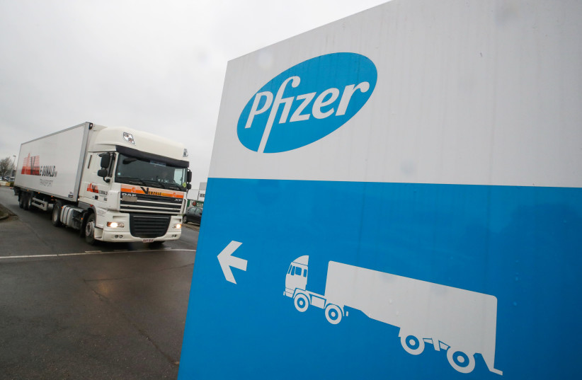 A refrigerated truck leaves the Pfizer plant in Puurs, Belgium December 3, 2020.  (photo credit: YVES HERMAN/REUTERS)
