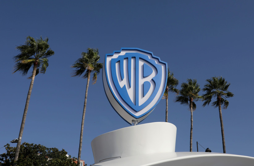 The Warner Bros logo is seen during the annual MIPCOM television programme market in Cannes, France, October 14, 2019. (photo credit: REUTERS/ERIC GAILLARD/FILE PHOTO)