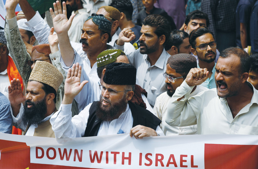 DEMONSTRATORS CHANT slogans condemning the diplomatic agreement between the UAE and Israel, in Karachi, Pakistan, in August.  (photo credit: REUTERS)