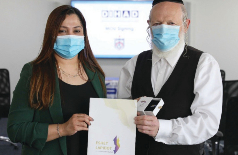 DIHAD BUSINESS development manager Jennie Robin with ZAKA Chairman Yehuda Meshi Zahav. (photo credit: Courtesy)