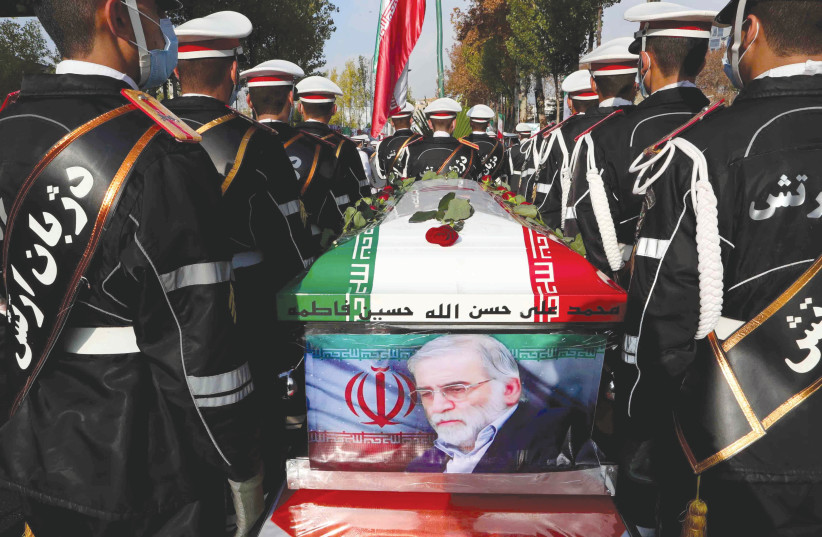 MEMBERS OF Iranian forces carry the coffin of Iranian nuclear scientist Mohsen Fakhrizadeh during a funeral ceremony in Tehran, last month. (photo credit: IRANIAN DEFENSE MINISTRY/REUTERS)