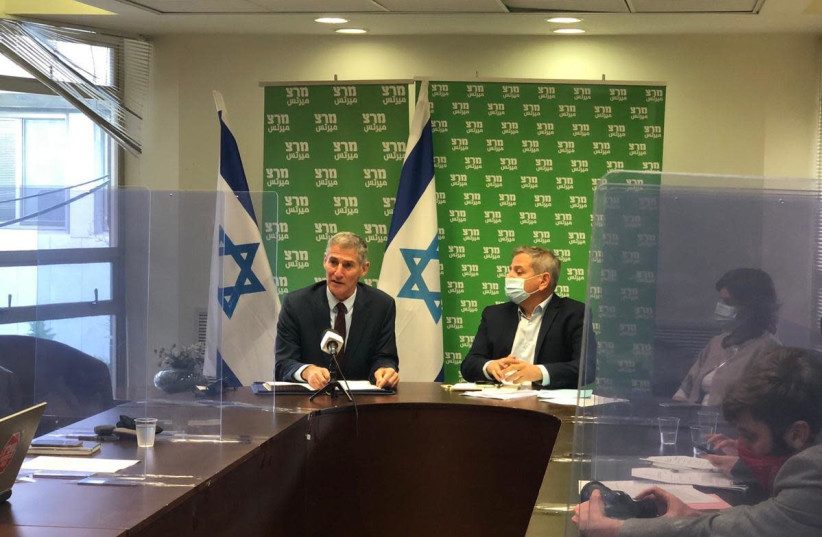 MK Yair Golan (L) is seen at the Meretz faction meeting announcing he is formally joining the party. (photo credit: ADVA MAHLER)