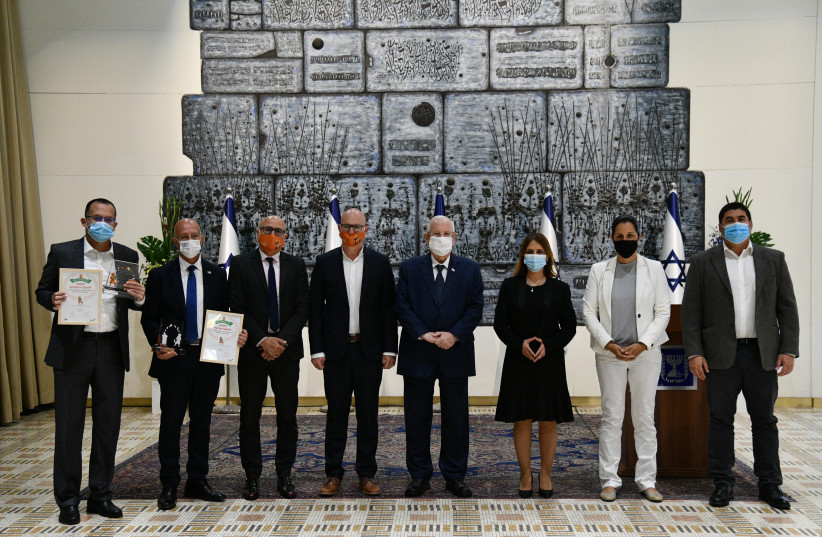 President Reuven Rivlin hosted Environmental Protection Minister Gila Gamliel, T.M.I.R head Rani Aidler and the heads municipalities and councils that won T.M.I.R's 2020 recylcling awards, on December 7, 2020. (photo credit: HAIM ZACH/GPO)