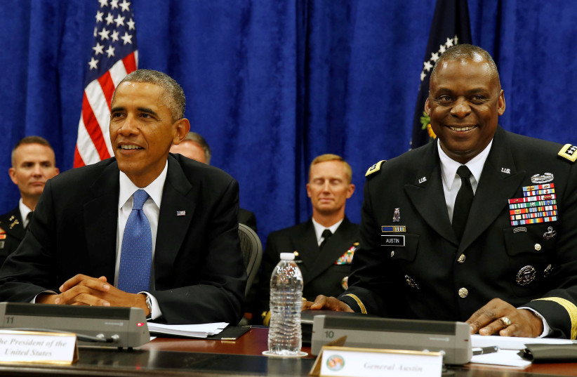 US President Barack Obama sits next to Commander of Central Command Gen. Lloyd Austin III during a briefing from top military leaders while at US Central Command at MacDill Air Force Base in Tampa, Florida, September 17, 2014.  (photo credit: LARRY DOWNING/REUTERS)