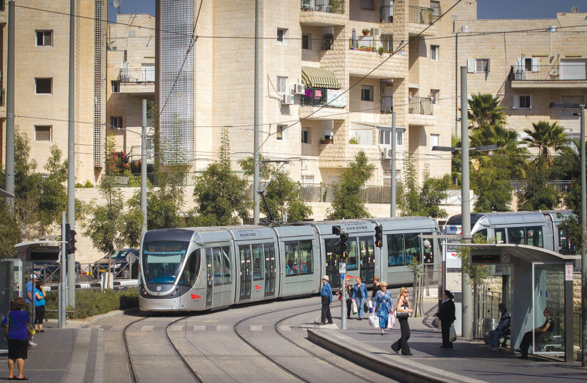 THE LIGHT rail makes a stop in Pisgat Ze’ev. With 45,000 residents, its council is divided into four areas. (photo credit: MIRIAM ALSTER/FLASH90)