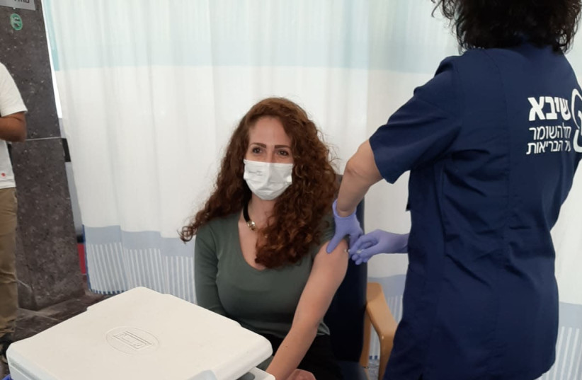 A participant takes part in a simulation for medical personnel at Sheba Medical Center for the Pfizer coronavirus vaccine. (photo credit: Courtesy)