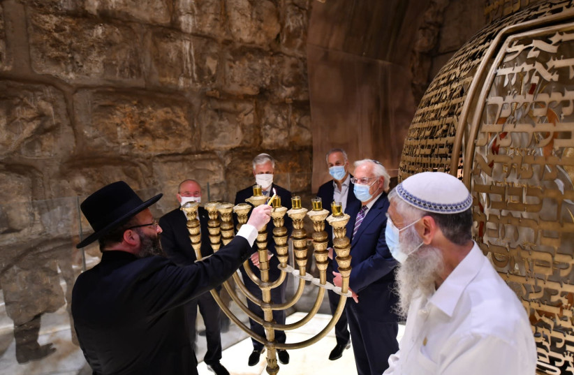Candle lighting ceremony at Western Wall Tunnels (photo credit: WESTERN WALL HERITAGE FOUNDATION)