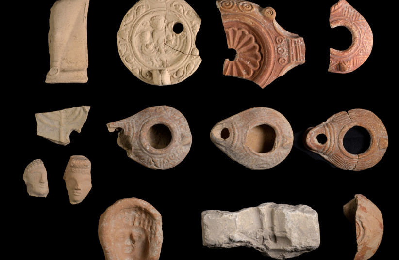 Ceramic oil lamps and stone lamp molds for their production were found along with terracotta figurines, December, 2020 (photo credit: DAFNA GAZIT/ISRAEL ANTIQUITIES AUTHORITY)
