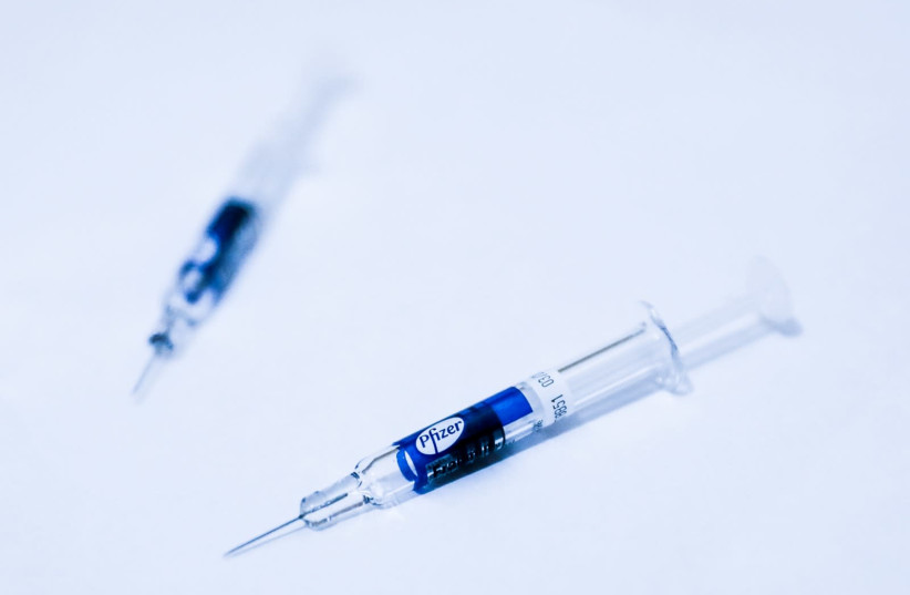 An illustrative photo of the Pfizer COVID-19 vaccine. (photo credit: MARC ISRAEL SELLEM/THE JERUSALEM POST)