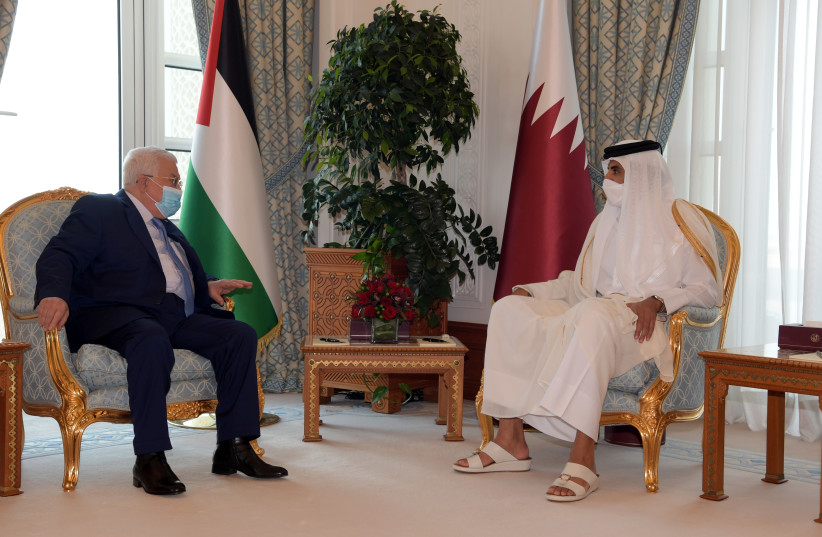 Qatar's Emir Sheikh Tamim bin Hamad Al Thani meets with Palestinian President Mahmoud Abbas in Doha, Qatar December 14, 2020. (photo credit: PALESTINIAN PRESIDENT OFFICE (PPO)/HANDOUT VIA REUTERS)