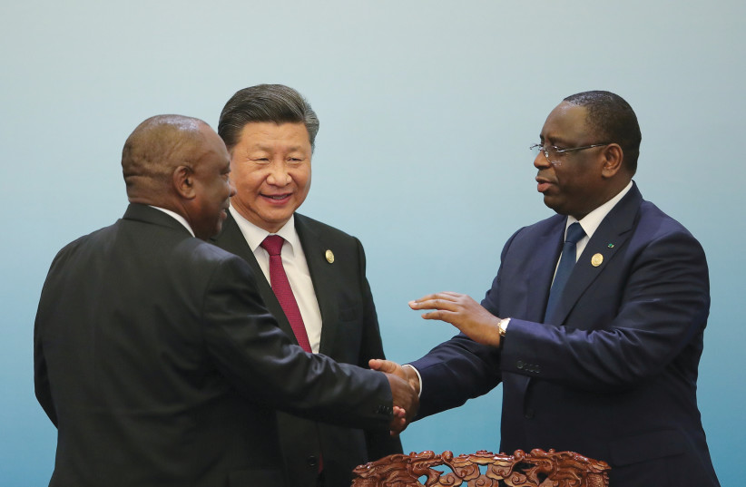 CHINESE PRESIDENT Xi Jinping, South African President Cyril Ramaphosa and Senegal’s President Macky Sall attend a joint news conference at the Great Hall of the People in Beijing in 2018. (photo credit: LINTAO ZHANG / REUTERS)