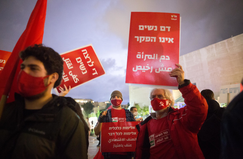 Activists protest against recent cases of violence against women at Habima square in Tel Aviv on November 25, 2020.  (credit: MIRIAM ALSTER/FLASH90)