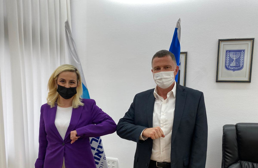Health Minister Yuli Edelstein is seen standing alongside gym forum chairwoman Stella Weinstein. (photo credit: Courtesy)