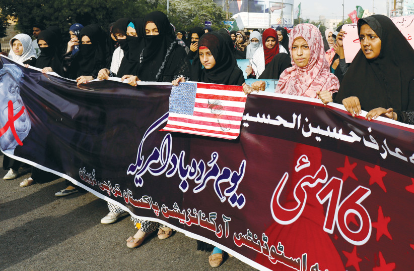 DEMONSTRATORS ATTEND an anti-Israel, anti-US rally in Karachi, Pakistan, in 2019.  (photo credit: AKHTAR SOOMRO / REUTERS)