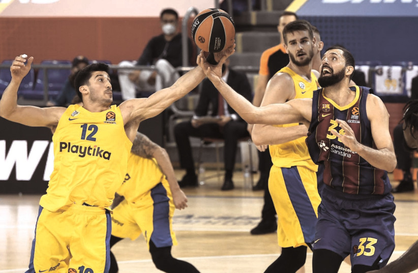 MACCABI TEL AVIV guard John DiBartolomeo is working his way back into form as the club is also playing much better with its captain in the lineup.  (photo credit: BARCELONA BASKETBALL CLUB)