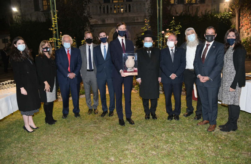Jared Kushner receiving his gift with the attendees at the Western Wall, December 21, 2020.  (photo credit: Courtesy)