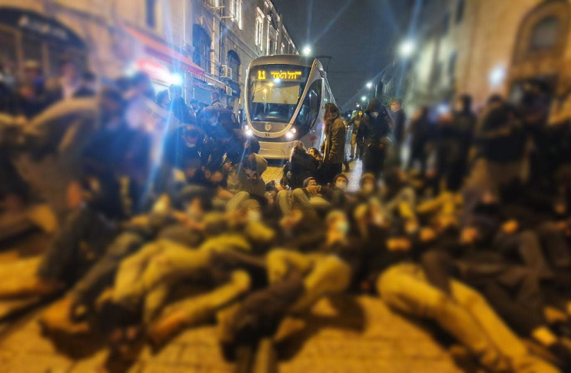 Demonstrators block light rail in Jerusalem in protest against death of Ahuvia Sandak, a hilltop youth member. (photo credit: ISRAEL POLICE)