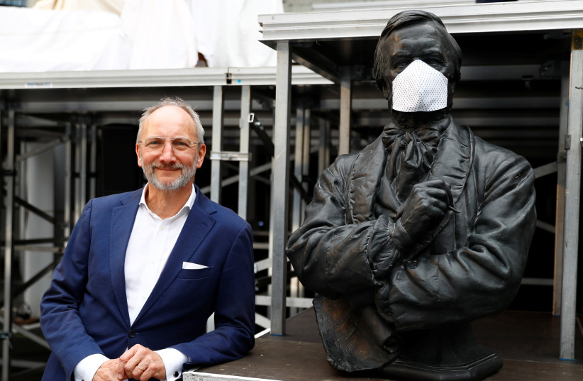 OPERA DIRECTOR Dietmar Schwarz poses beside a statue of German composer Richard Wagner in Berlin. Wagner’s antisemitic tirades erased Jewish composers like Meyerbeer from history at the time. (photo credit: FABRIZIO BENSCH / REUTERS)