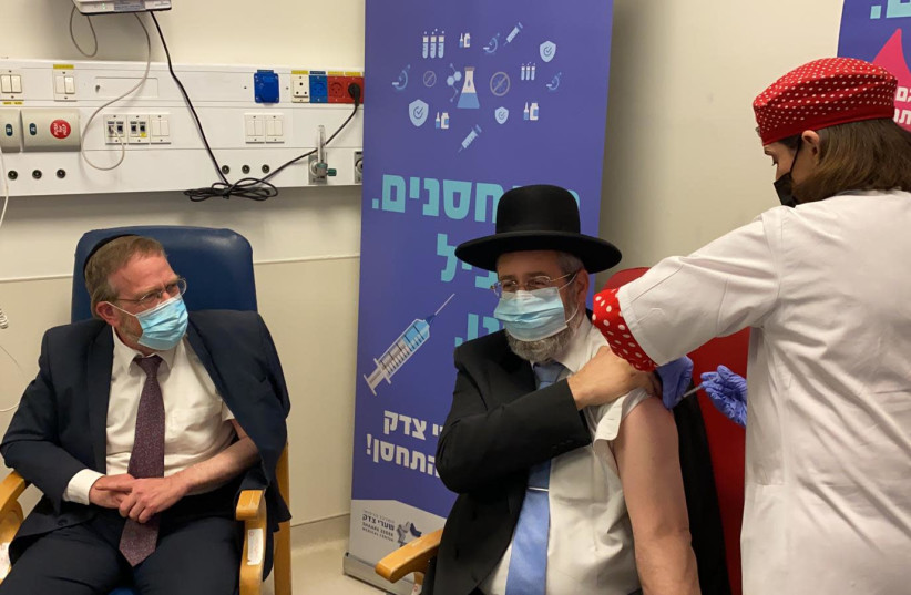 Chief Rabbi David Lau receives the coronavirus vaccine at Shaare Tzedek Medical Center in Jerusalem (photo credit: Courtesy)