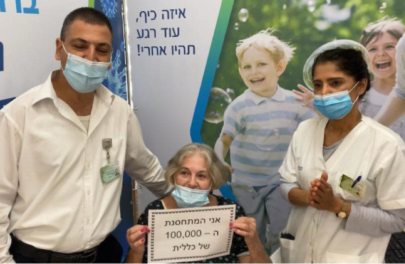 Adina Yaakobi (center) and Amir Itah (left) at Clalit's coronavirus vaccination center in Rehovot. (photo credit: CLALIT HEALTH SERVICES)