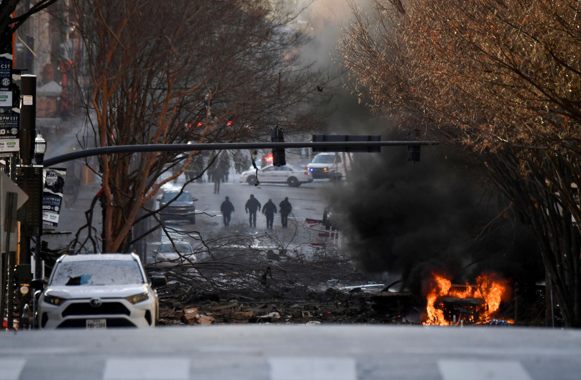 A vehicle burns near the site of an explosion in the area of Second and Commerce in Nashville (photo credit: ANDREW NELLES/TENNESSEAN.COM/USA TODAY NETWORK VIA REUTERS.)