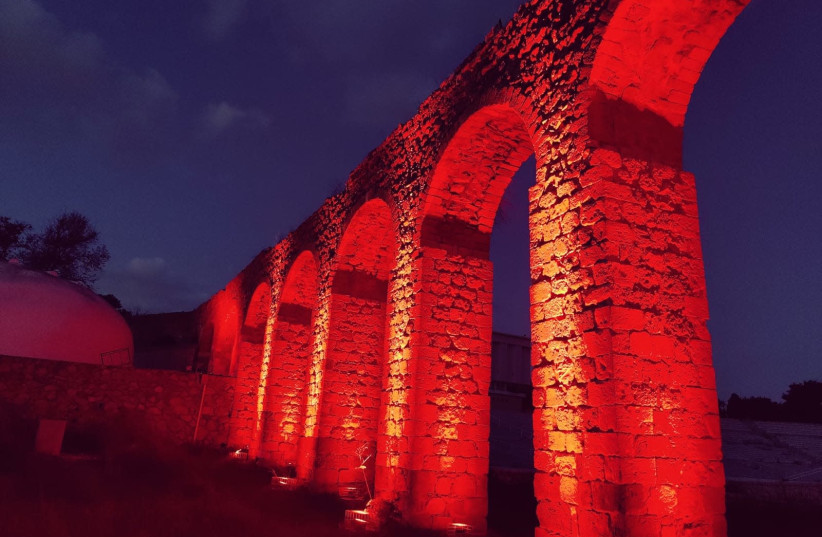 The Ghetto Fighters' House Museum in northern Israel is illuminated in red as a part of the worldwide Red Alert Campaign, which seeks to raise awareness and funds for employees in live entertainment and cultural institutions who have been financially ruined by the COVID-19 crisis. 26, December, 2020 (photo credit: COURTESY GHETTO FIGHTERS' HOUSE MUSEUM)