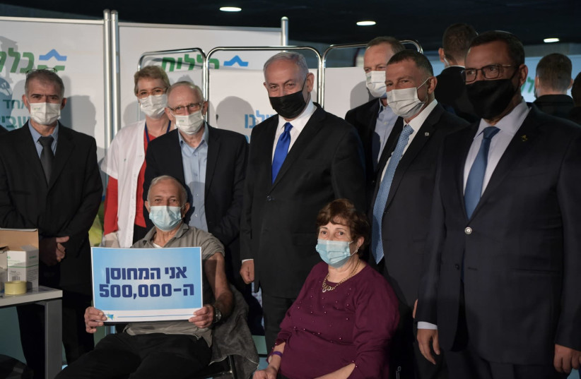 Prime Minister Benjamin Netanyahu and Health Minister Yuli Edelstein are seen with Herzl Levy, the 500,000th Israeli to be given the COVID-19 vaccine. (photo credit: KOBI GIDEON/FLASH90)