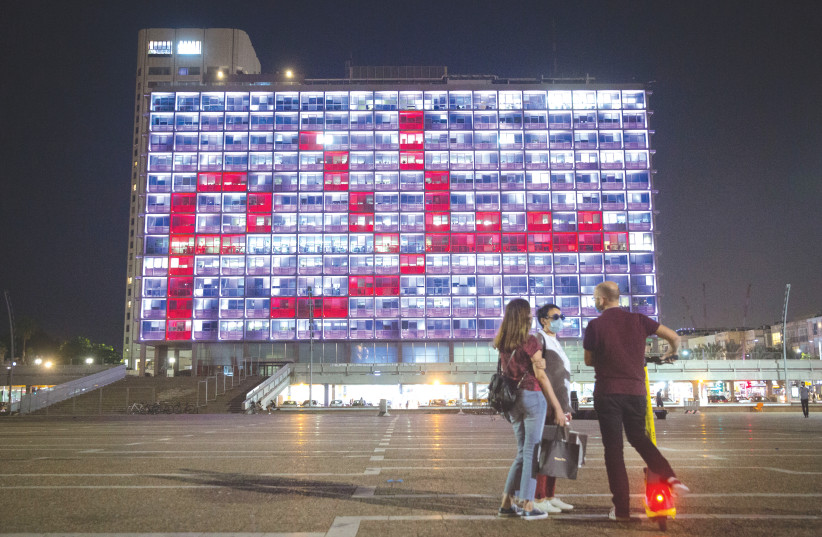 THE TEL AVIV municipality is lit up with the word ‘peace’ in Arabic in September. (credit: MIRIAM ALSTER/FLASH90)