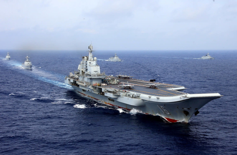 China's aircraft carrier Liaoning takes part in a military drill of Chinese People's Liberation Army (PLA) Navy in the western Pacific Ocean. (credit: STRINGER/ REUTERS)