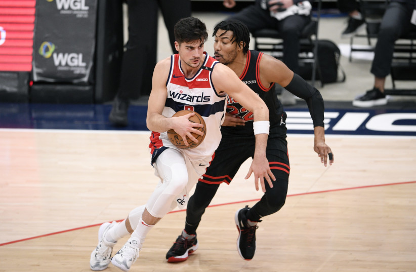 WASHINGTON WIZARDS Israeli forward Deni Avdija drives past Chicago Bulls defender Otto Porter Jr. during the Bulls’ 115-107 victory over the Wizards late Tuesday night. (photo credit: USA TODAY)