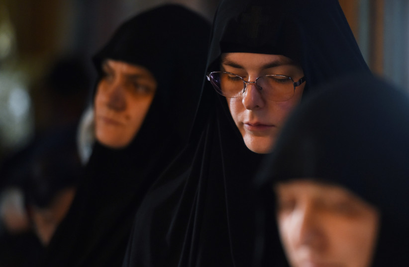Serbian Orthodox nuns attend the holy liturgy in the monastery of Stubal, on the feast of St. Petka, amid the spread of the coronavirus disease (COVID-19) in Stubal, Serbia, October 27, 2020. (photo credit: REUTERS)