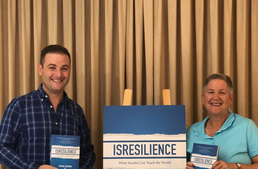 Authors Michael Dickson and Dr. Naomi L. Baum with copies of their new book. (photo credit: ISRAELNEWSTAND)