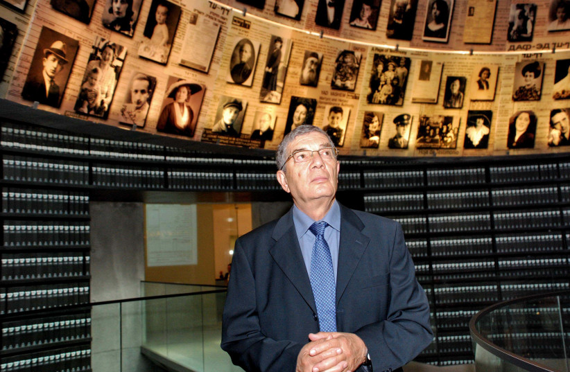 GAZING AT photographs of Holocaust victims in the Hall of Names, on the Mount of Remembrance. (photo credit: COURTESY YAD VASHEM)