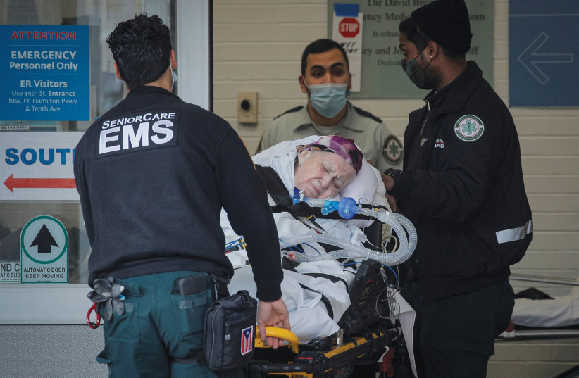 EMS WORKERS bring a patient to Maimonides Medical Center in Brooklyn, New York City, last month. (Brendan McDermid/Reuters)
